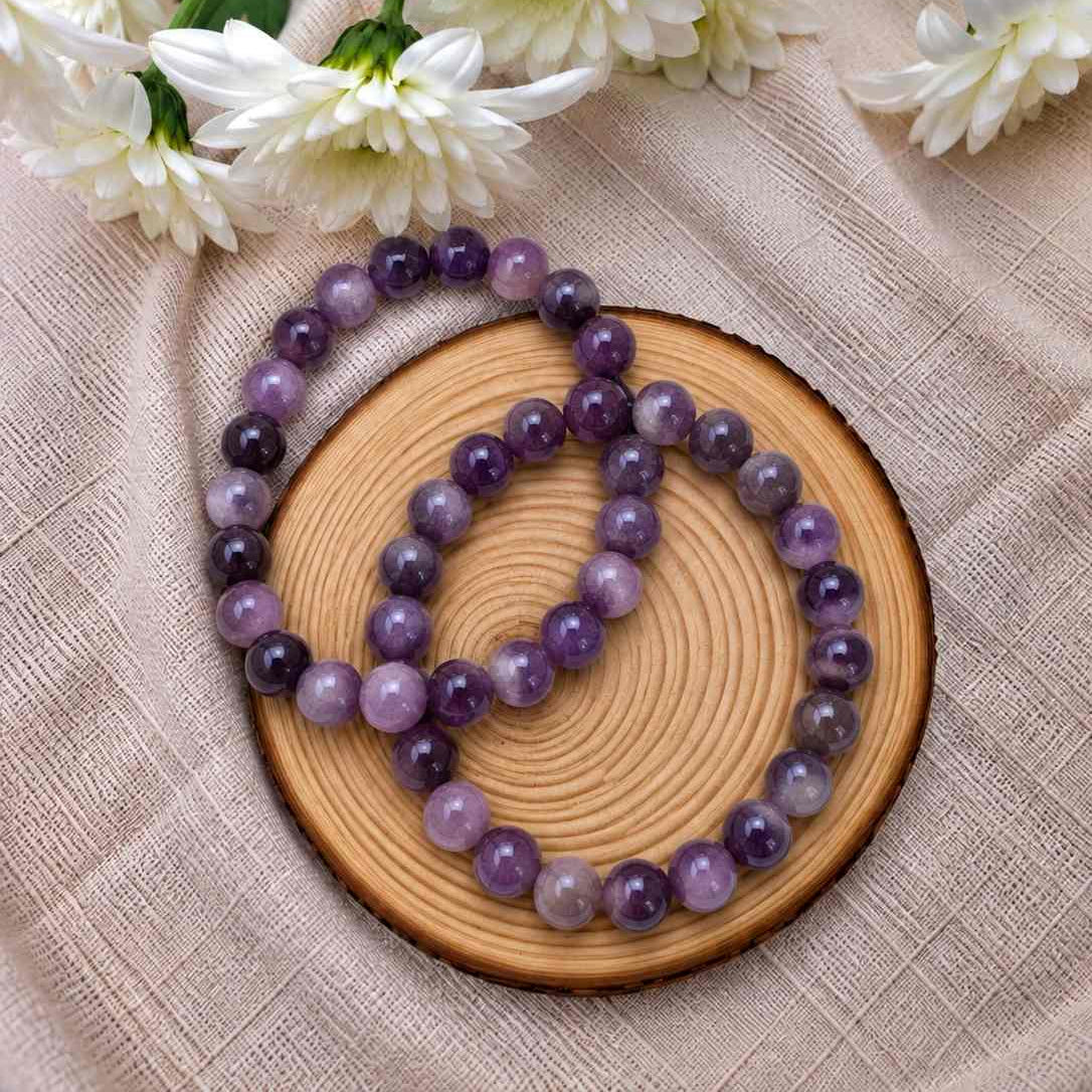 Pulsera de amatista natural de 6 mm con cuentas en tonos violetas y púrpuras, acabado delicado y diseño elegante para llevar a diario