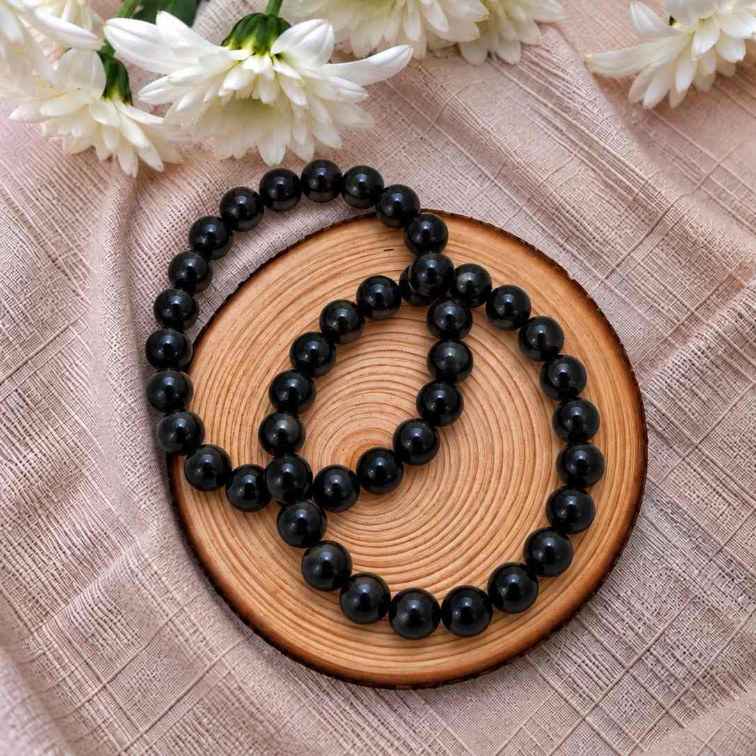 Pulsera de obsidiana natural de 8 mm con cuentas negras de acabado brillante, diseño sofisticado y atemporal para complementar cualquier estilo