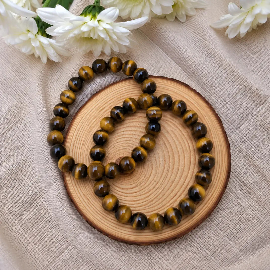 Pulsera de ojo de tigre natural de 6 mm con piedras en tonos dorados, marrones y negros, con reflejos naturales y diseño elegante para uso diario