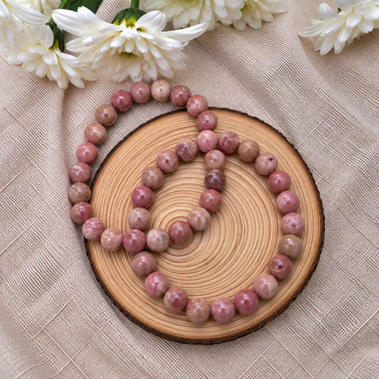 Pulsera de rodonita lisa natural de 6 mm con piedras en tonos rosados y negros, superficie suave y diseño elegante para uso diario
